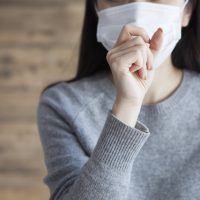 マスクする女性、風邪Woman wearing a mask has a cough